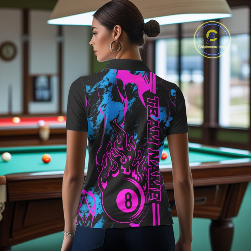 Back view female model wearing a polo shirt with flaming billiard 8 ball motif on a blue and green abstract background.