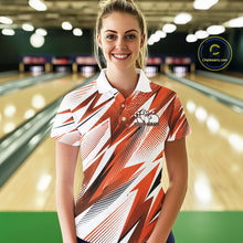 Load image into Gallery viewer, Woman in a patterned shirt standing in a bowling alley with a logo in the corner.