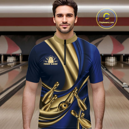 A man wearing a custom bowling shirt with a blue and gold satin-like graphic design, featuring bowling pins and balls, set against a bowling alley background.