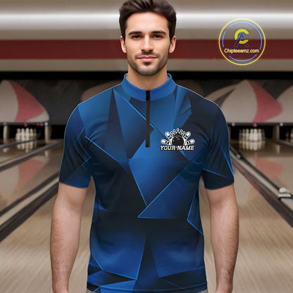Man wearing a blue bowling shirt with a logo in a bowling alley