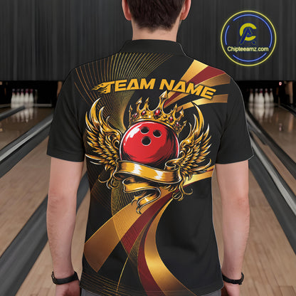 Person wearing a black bowling shirt with a red bowling ball design in a bowling alley.