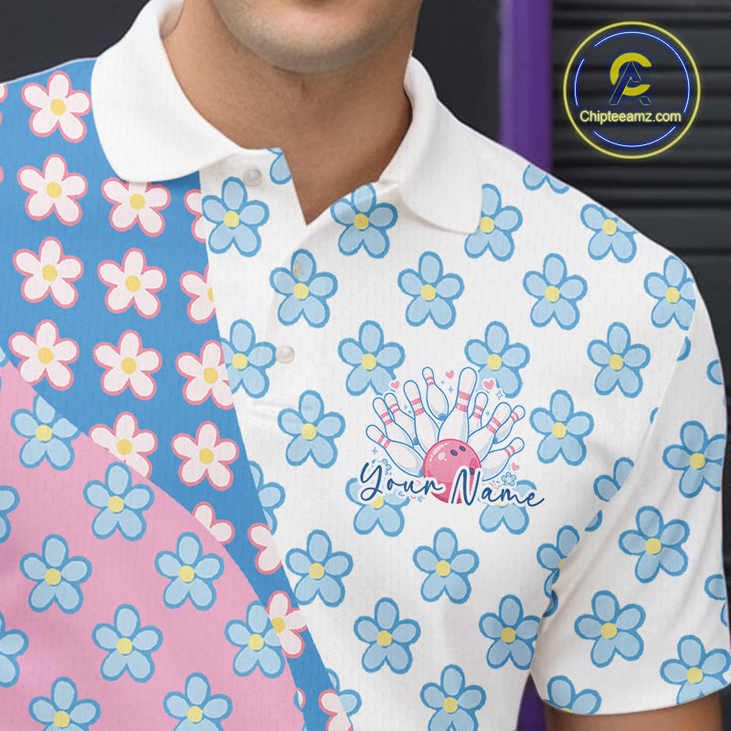 Close-up view of the left chest of a white bowling polo shirt showing white, blue and pink floral pattern with detailed decorative design.
