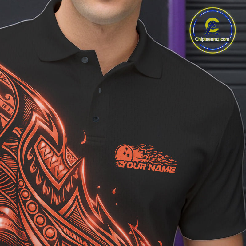 Left chest close-up of a black and orange bowling polo shirt featuring Polynesian-style bowling artwork with flame accents.