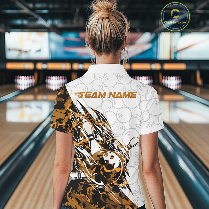 Back view of a female model in a white bowling quarter-zip shirt displaying orange camo accents and bowling pin artwork.