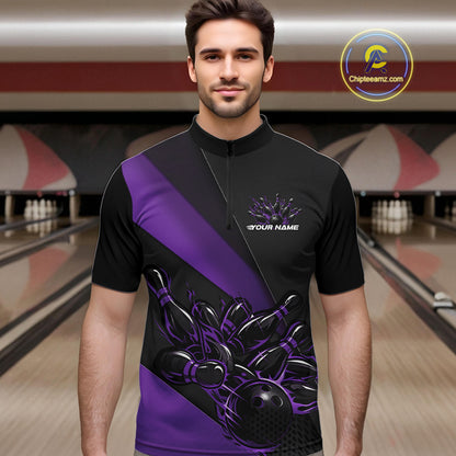Male model front view inside bowling venue wearing black and purple quarter zip shirt showcasing flame bowling strike artwork