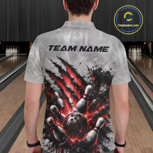 Load image into Gallery viewer, Back view of a male model wearing a gray bowling polo shirt with a dramatic red bowling ball and pins graphic accented by claw-mark artwork in a bowling lane.