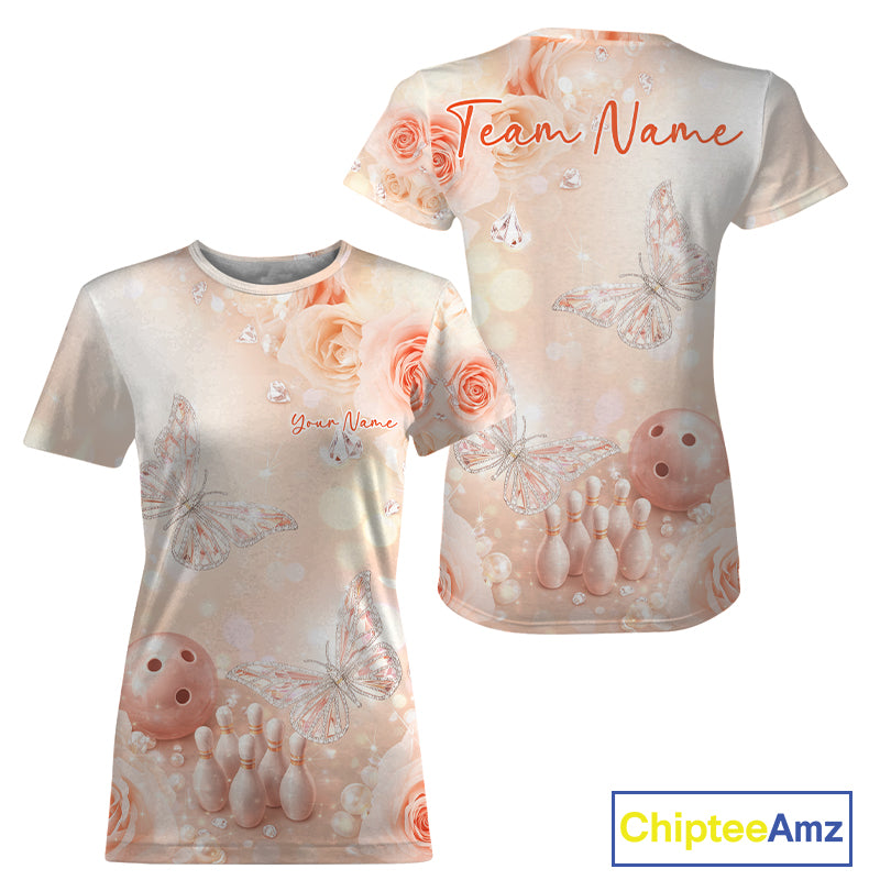 Front and back view of a women’s crewneck bowling T-shirt with pastel glitter butterflies floating above bowling pins and a bowling ball.