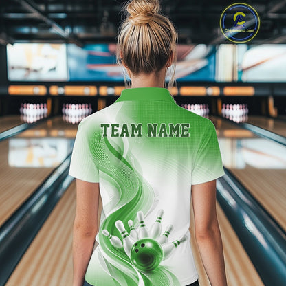Back view of a female model wearing a white and green bowling quarter-zip shirt with fluid wave patterns and bowling-inspired imagery in a bowling alley