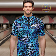 Load image into Gallery viewer, Man in a bowling alley wearing a blue, teal, and black leopard-print bowling quarter zip shirt with “Your Name” and a bowling pins graphic on the chest.
