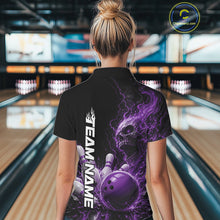 Load image into Gallery viewer, Back view of a female model in a bowling alley wearing a black bowling quarter zip shirt featuring a purple fiery skull with lightning striking a bowling ball and pins and a custom name.

