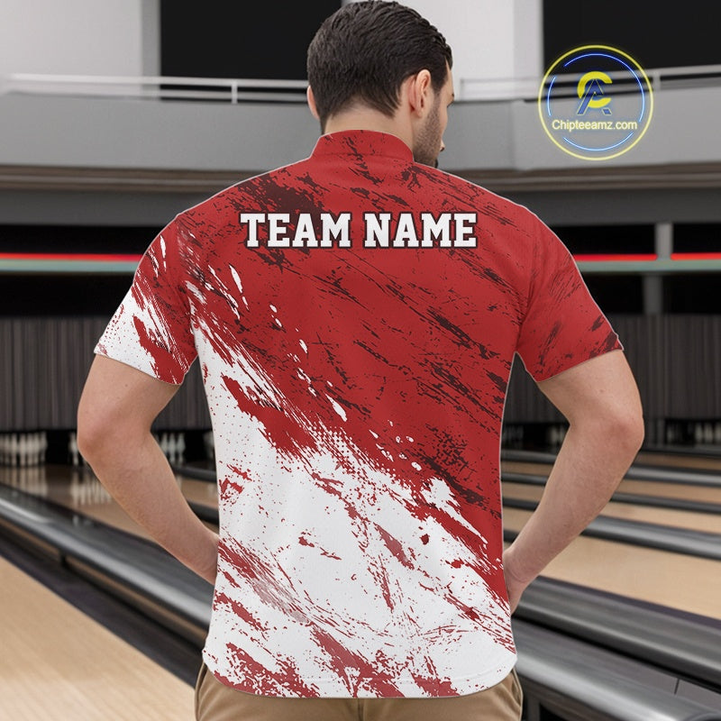 Man wearing a red and white bowling shirt with 'TEAM NAME' on the back, standing in a bowling alley.