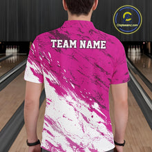 Load image into Gallery viewer, Person wearing a pink and white bowling shirt with 'TEAM NAME' on the back, standing in a bowling alley.