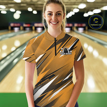 Load image into Gallery viewer, Woman wearing a yellow and black bowling shirt with a logo in a bowling alley.