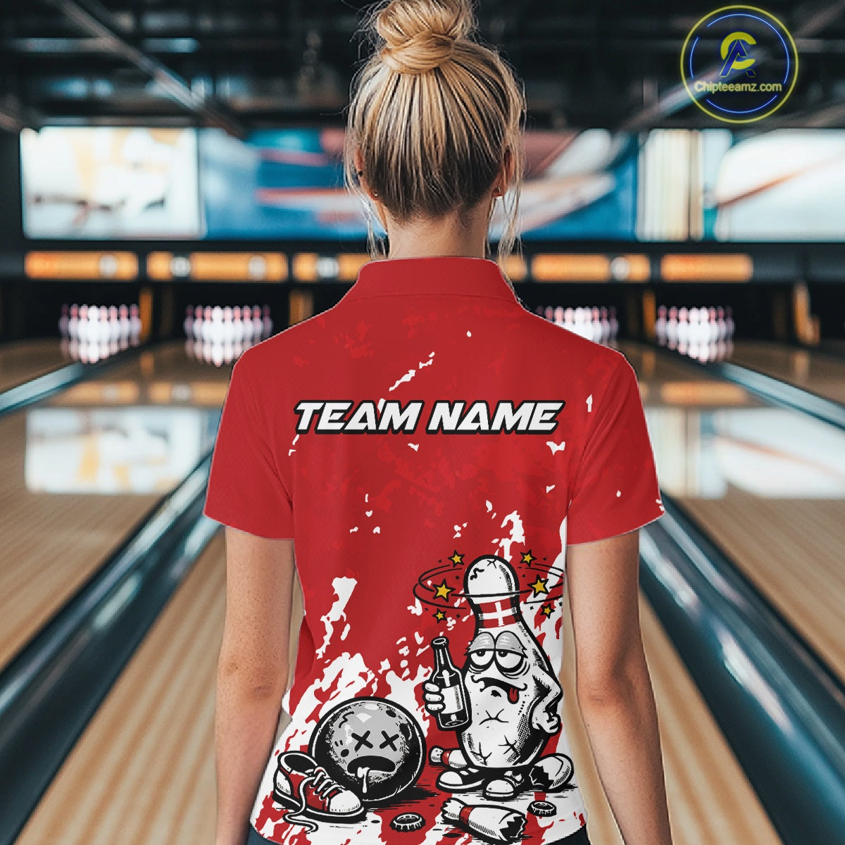 Back view female model wearing red and white quarter zip bowling shirt in bowling lane, humorous bowling pin beer bottle illustration