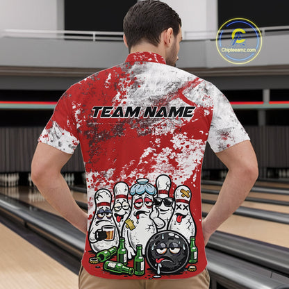 Male model at a bowling lane wearing a quarter zip shirt, front view showcasing red and white splatter design with playful bowling pins and bowling ball illustration