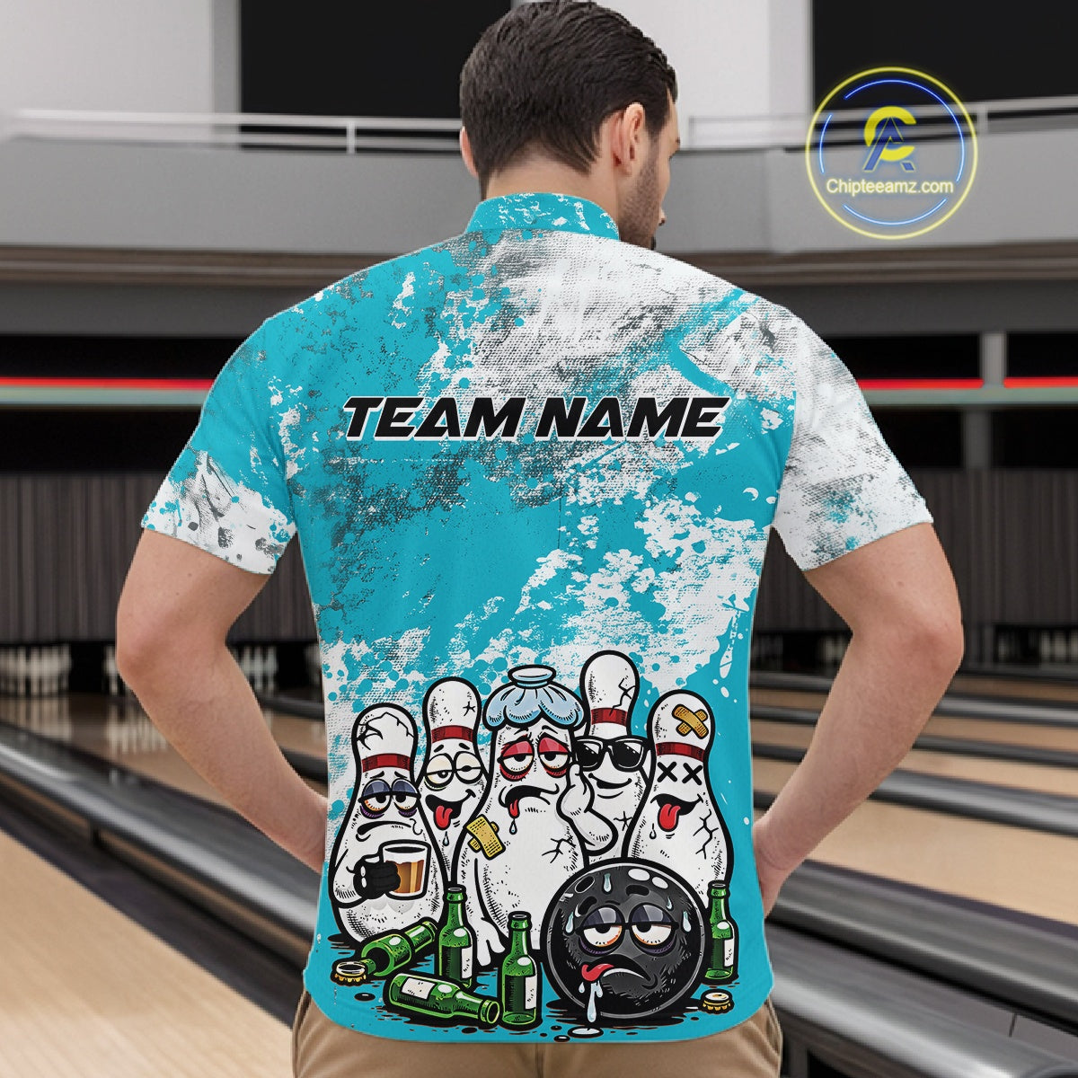Male model at a bowling lane wearing turquoise blue and white quarter zip shirt, front view featuring cartoon bowling pins and beer bottle themed bowling illustration