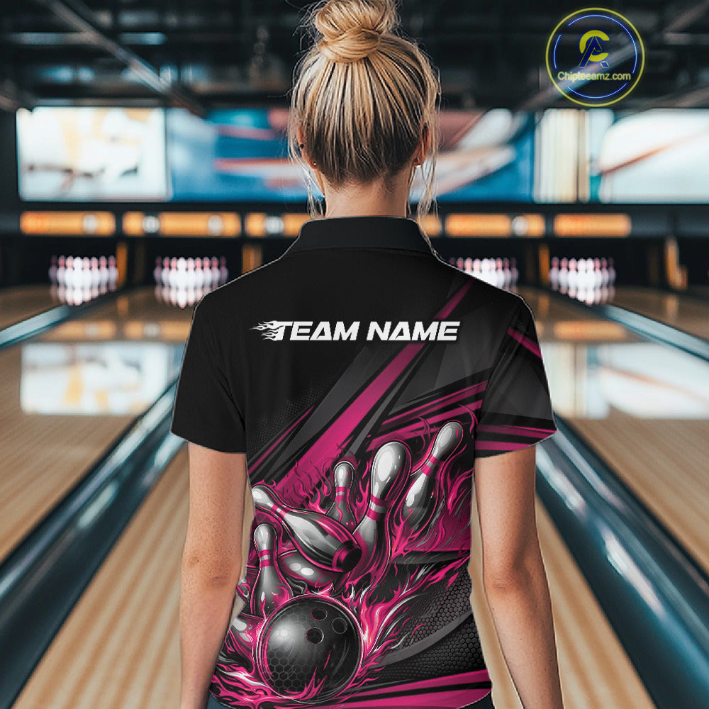 Back view of a female bowler wearing a black quarter-zip shirt, hot pink flame bowling strike design with abstract stripe details.