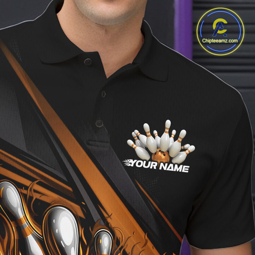 Close-up left chest detail of black bowling polo shirt featuring gold flame bowling ball and pins emblem with geometric stripe accents
