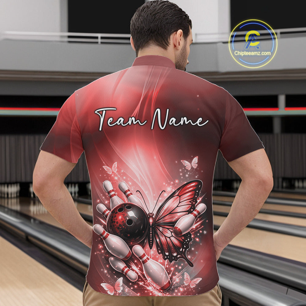 Front view of a male model in a bowling venue wearing a red quarter-zip bowling shirt featuring a butterfly beside a bowling ball and pins.