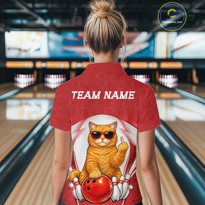 Back view of a female model in a bowling alley wearing a white and red quarter-zip shirt featuring a cool British Shorthair cat and bowling ball artwork.