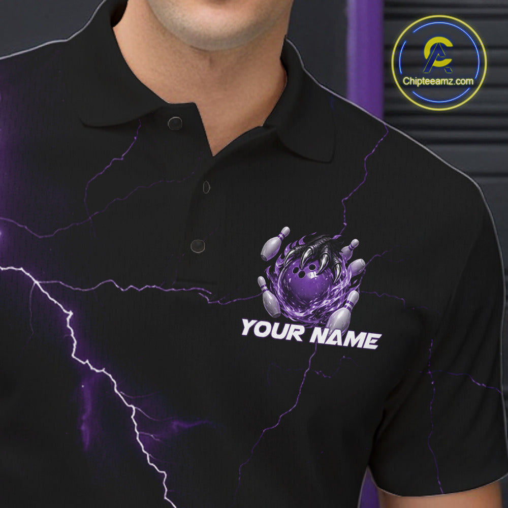 Close-up of the left chest on a black and purple bowling polo featuring a dragon claw and flaming bowling ball motif.