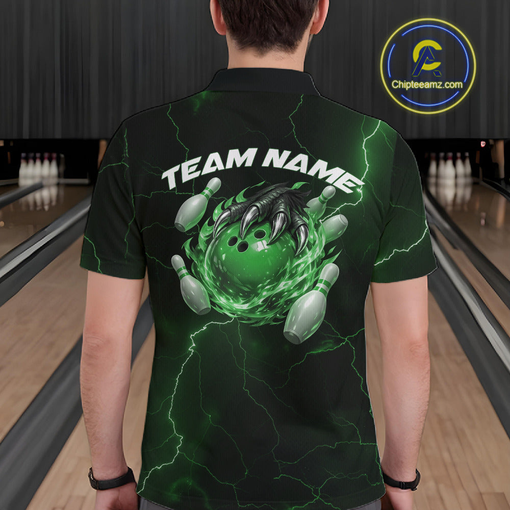 Back view of a black and green mens bowling polo displaying a flaming bowling ball held by a dragon claw.