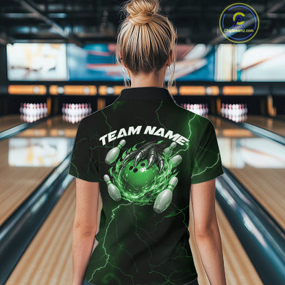 Back view of a black and green womens bowling polo showcasing a flaming bowling ball and dragon claw motif.