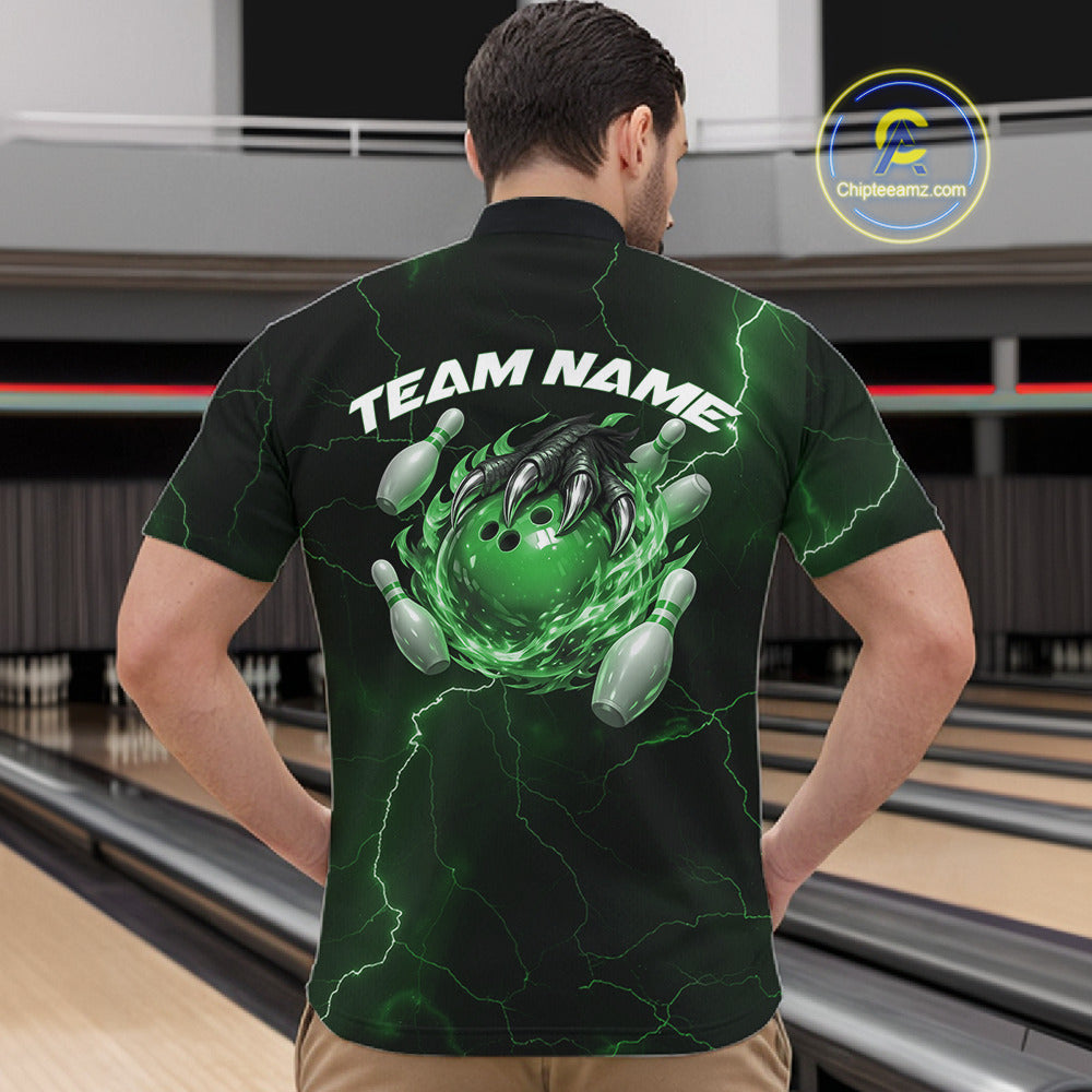 Front view of a black and green mens bowling quarter-zip showcasing a dragon claw, flaming bowling ball, and scattered pins.