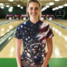 Load image into Gallery viewer, Front view of a female model wearing a bowling quarter zip shirt featuring a raccoon in patriotic sunglasses rolling a bowling ball through scattered pins with a distressed American flag backdrop in a bowling lane.