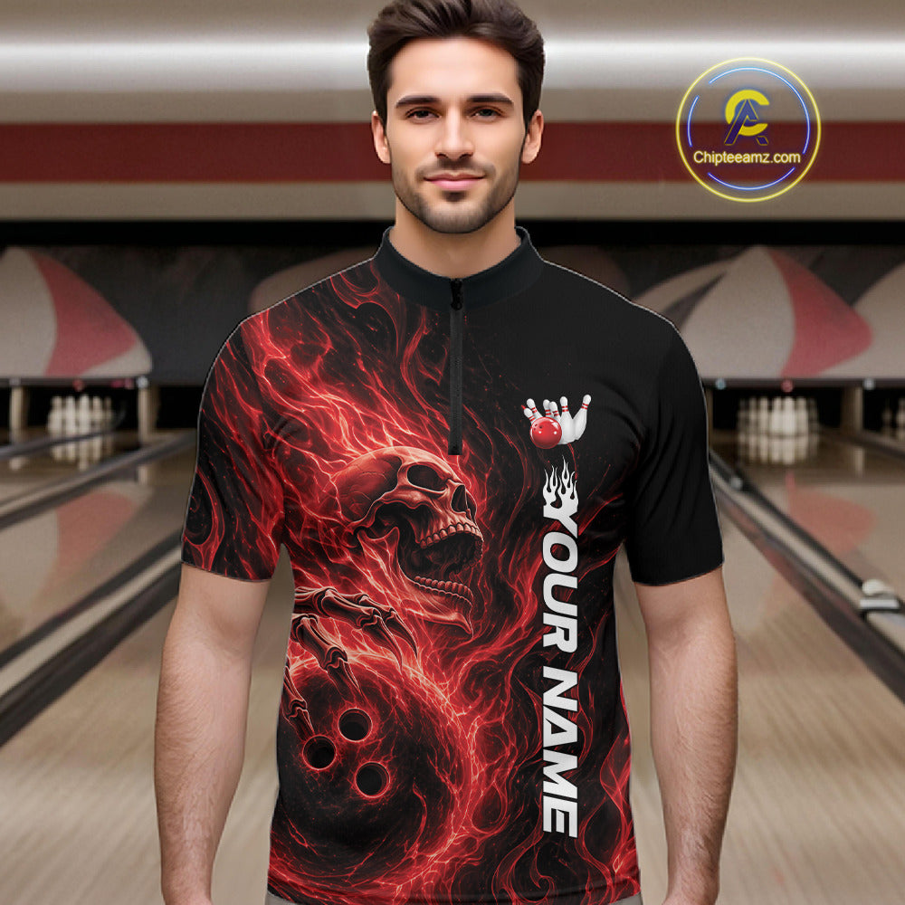 Male model wearing a black bowling quarter-zip shirt in a bowling alley with a skull holding a bowling ball amid swirling red energy flames