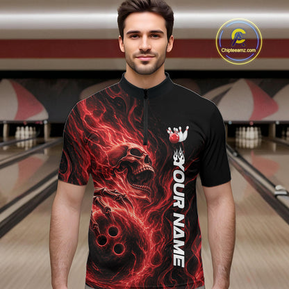 Male model wearing a black bowling quarter-zip shirt in a bowling alley with a skull holding a bowling ball amid swirling red energy flames