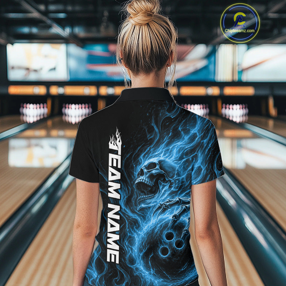 Back view of a female bowler wearing a black bowling quarter-zip shirt featuring a blue flaming skull holding a bowling ball with swirling energy effects