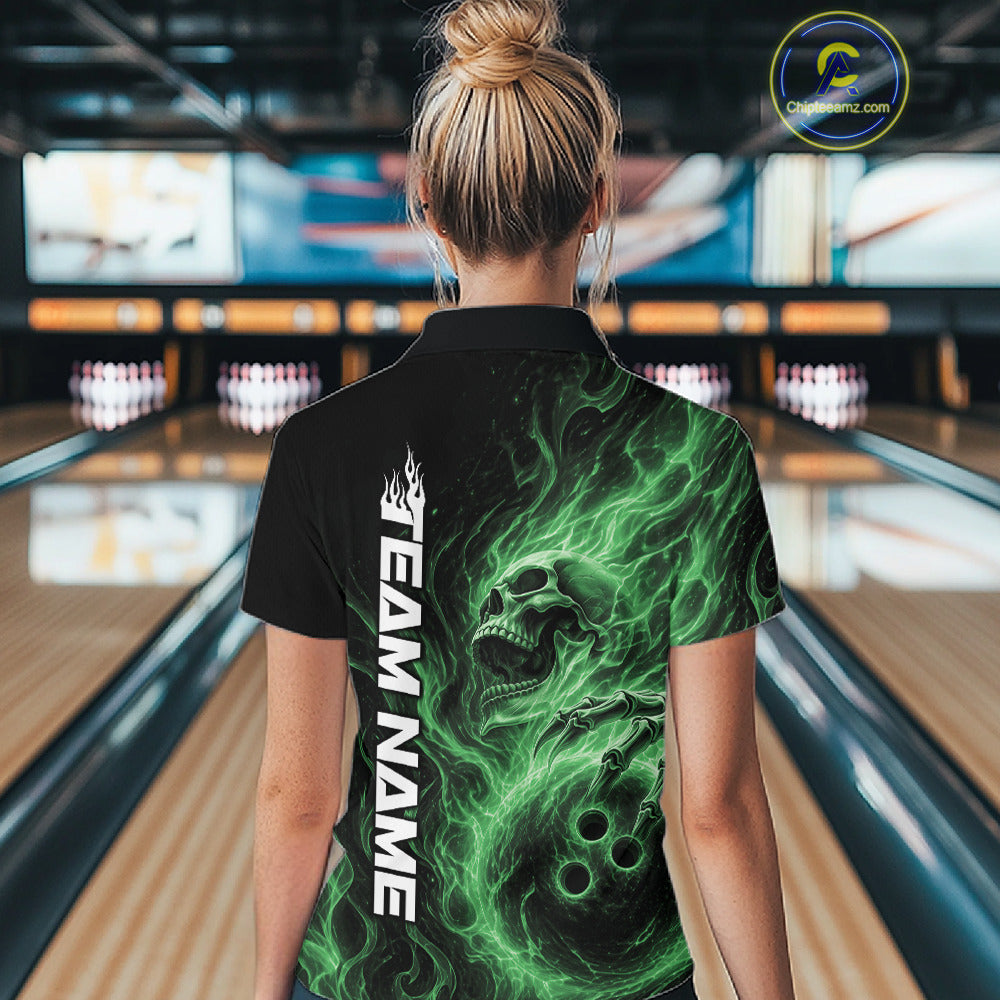 Back view of a female bowler wearing a black bowling quarter-zip shirt featuring a green flaming skull holding a bowling ball surrounded by swirling energy flames