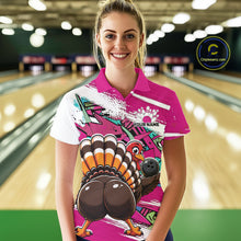 Load image into Gallery viewer, Front view of a female model wearing a pink custom bowling polo shirt with a funny graffiti turkey holding a bowling ball, paint splatter accents, and a personalized name in a bowling alley.