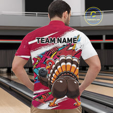 Load image into Gallery viewer, Back view of a male model in a bowling alley wearing a red custom quarter zip bowling shirt with a funny graffiti turkey holding a bowling ball, paint splatter accents, and a personalized name.