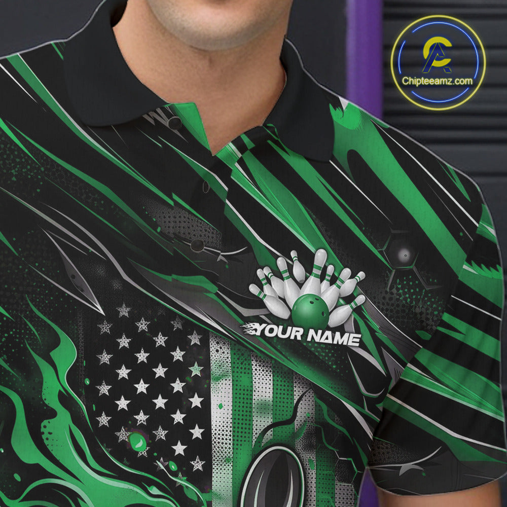 Close-up left chest view of a black and green bowling polo shirt featuring a patriotic flaming bowling ball striking pins with American flag details.