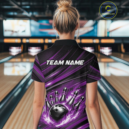 Female model at a bowling lane, back view of black and purple quarter zip shirt showcasing fiery bowling ball hitting pins with dynamic abstract stripes