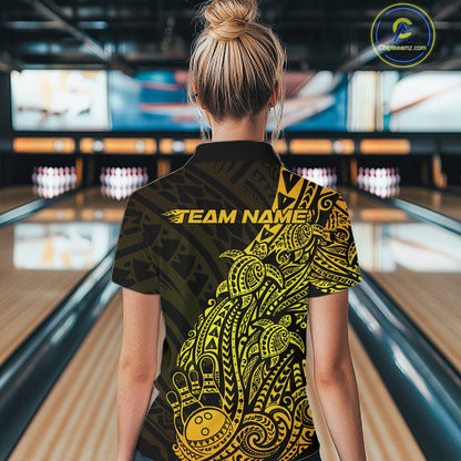 Back view of a female model in a black and gold bowling quarter-zip shirt featuring tribal-inspired bowling motifs.