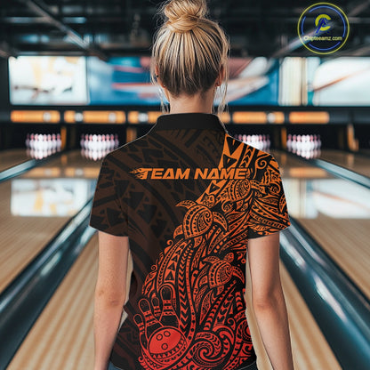 Back view of a female model in a black and red orange bowling quarter-zip shirt displaying Polynesian-inspired bowling artwork.