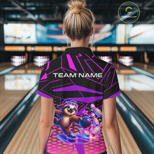 Load image into Gallery viewer, Person wearing a bowling shirt with a cartoon character and 'TEAM NAME' text in a bowling alley.