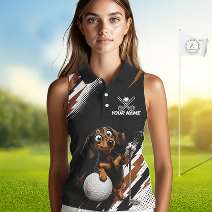 A woman modeling a sleeveless black polo shirt with a custom dachshund and golf graphic, set against a blurred golf course background.