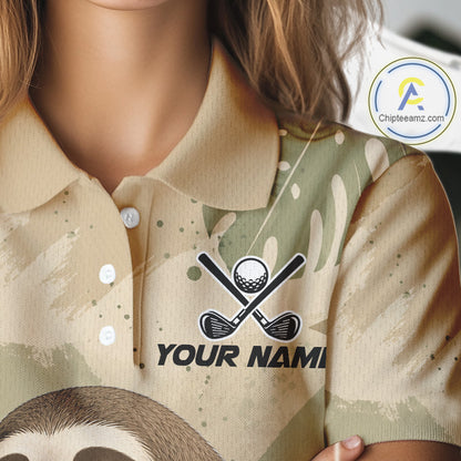 A close-up of a person wearing a short-sleeve polo shirt with a beige and sage green camouflage pattern, featuring a black graphic of crossed golf clubs and a golf ball above the placeholder text 'YOUR NAME'.