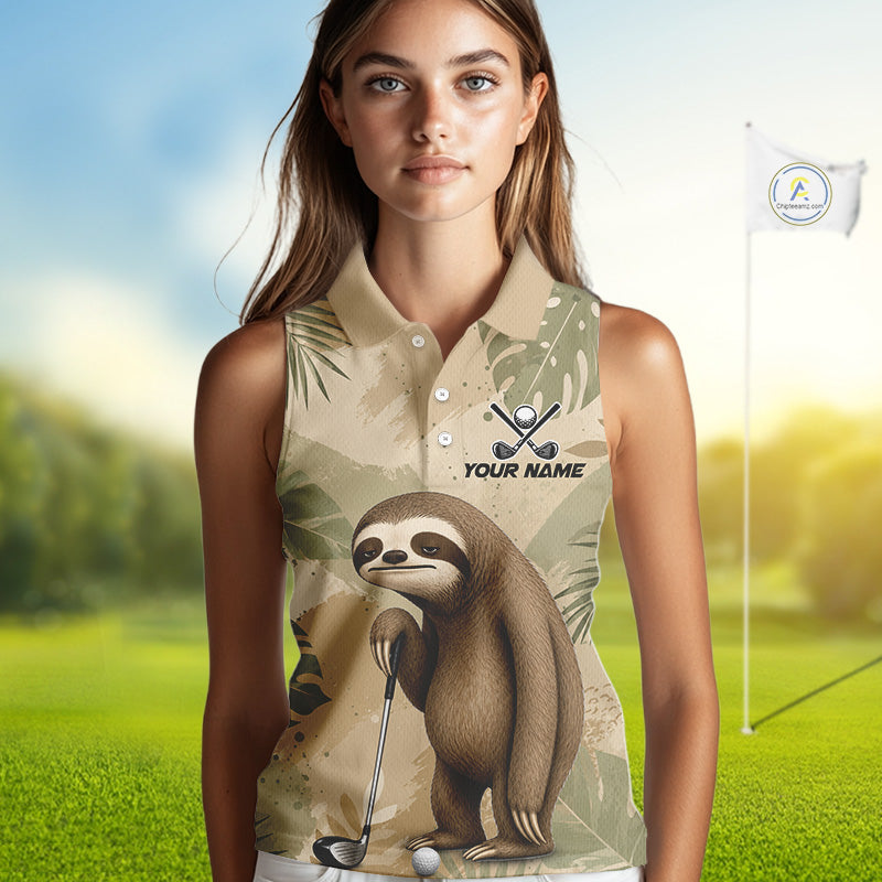 A woman modeling a sleeveless collared polo shirt with a tropical leaf pattern and a sloth graphic holding a golf club, set against a blurred golf course background 