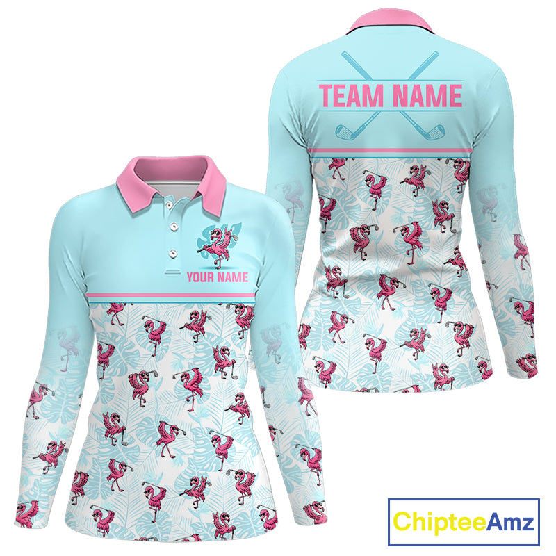 Front and back views of a long-sleeve polo shirt in light blue and pink, featuring a repeating flamingo and palm leaf pattern. The front has a pink collar, pink trim, and customizable text placeholders 'YOUR NAME' and 'TEAM NAME' on the back with crossed golf clubs.