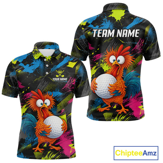 Front and back views of a short-sleeve polo shirt on a white background. The shirt features a black base with a vibrant multicolor abstract paint splatter pattern in blue, green, yellow, and pink, along with a cartoon orange rooster holding a white golf ball.