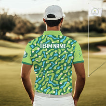 Load image into Gallery viewer, Man wearing a green patterned polo shirt with 'TEAM NAME' on a golf course