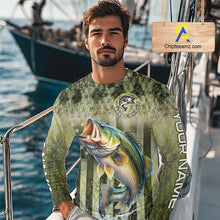 Load image into Gallery viewer, Man wearing a fishing-themed shirt with a large bass graphic on a boat 