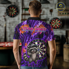 Load image into Gallery viewer, Person wearing a colorful shirt with a raccoon and dartboard design, standing in a room with dartboards.