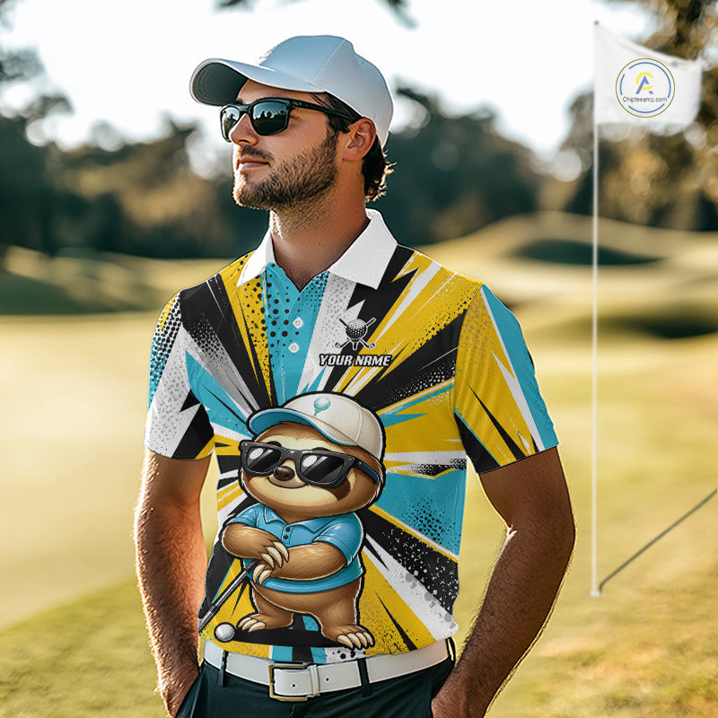 A man wearing a custom printed golf polo shirt with a cartoon sloth graphic, standing on a golf course. The shirt features a bold geometric pattern in yellow, blue, black, and white, with a white collar and a printed chest logo