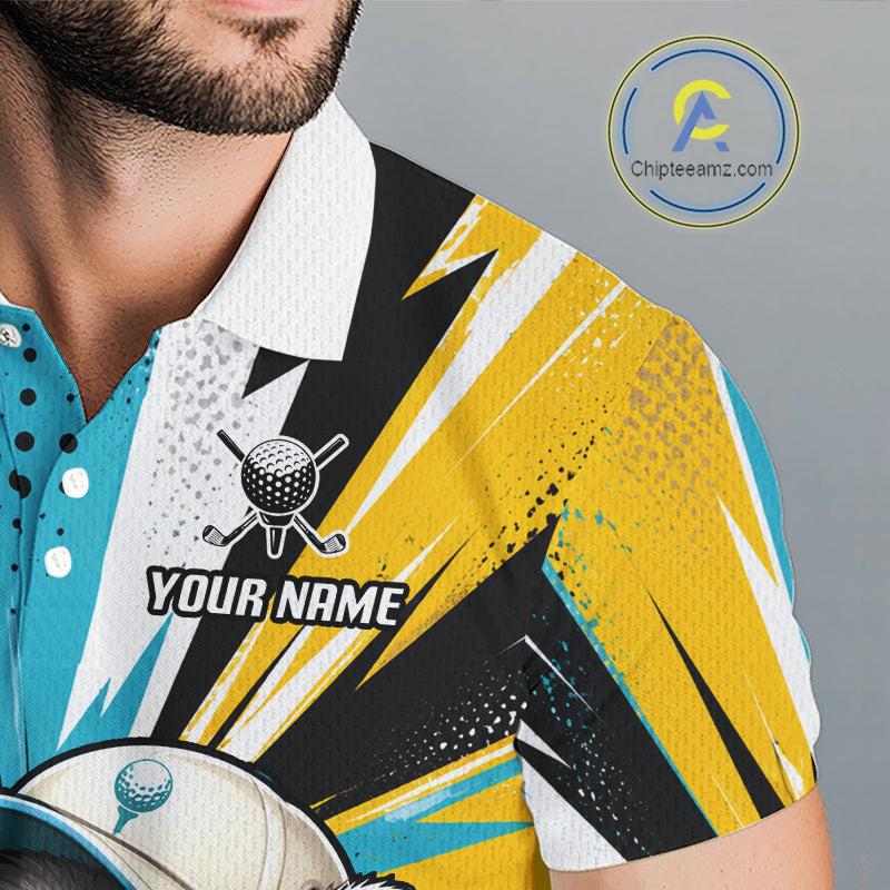 A close-up of a man wearing a short-sleeve polo shirt with a bold graphic print in yellow, black, white, and turquoise. The shirt features a golf ball and clubs logo with the text 'YOUR NAME' on the chest.